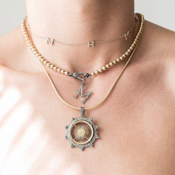 Hand Carved Argentinian Sunburst Coin Pendant